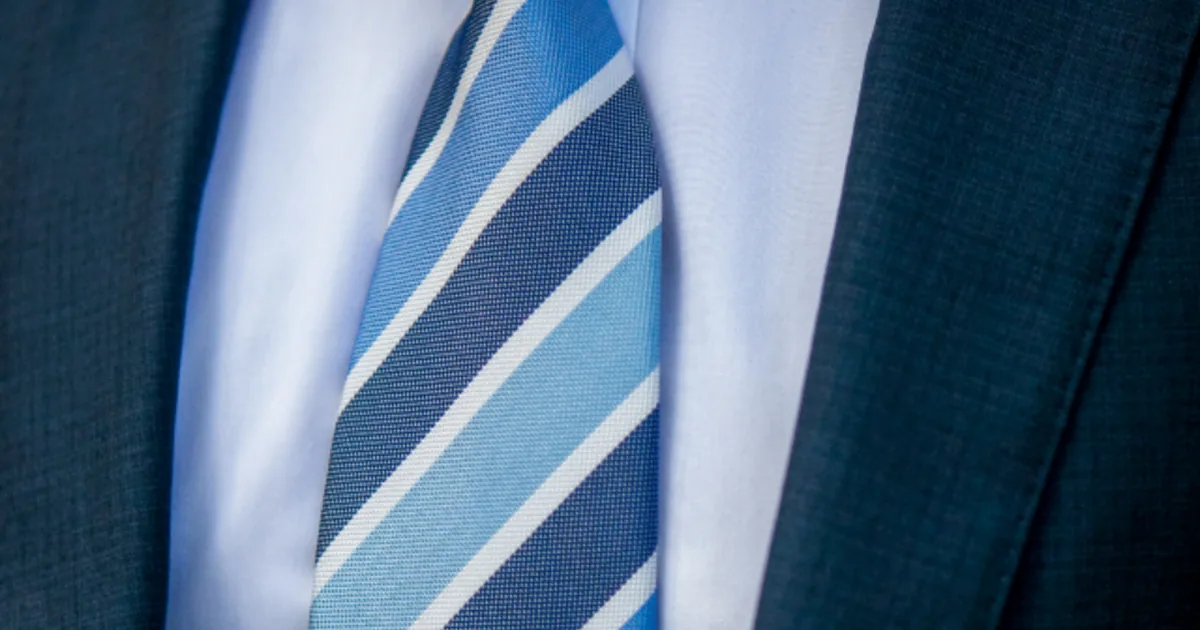 A man in a tailored suit — a classic-archetype silhouette, one of the labels this report ranks
