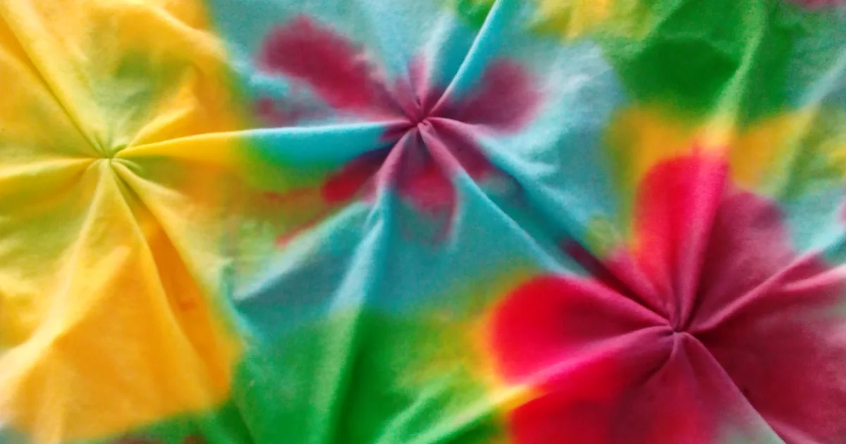 Hand-painted cloth in yellow, green, blue and pink — the colour-under-trend this report measures