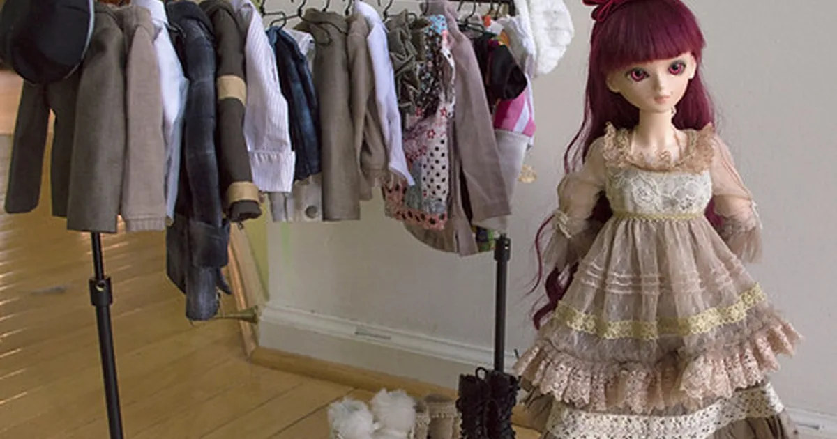 Garments on wooden hangers in a row — the not-yet-worn potential this report measures