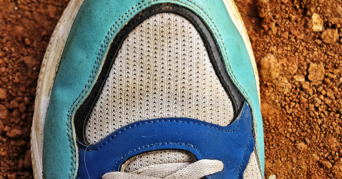A close-up of a colourful sneaker resting on the ground — footwear, the weakest-link theme the model most often names